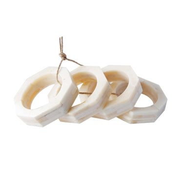 Set of four white and beige marble-look resin octagon napkin rings