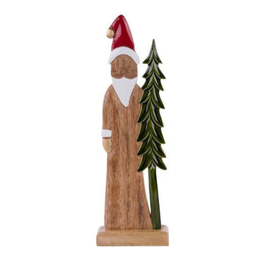 Wooden figure of a Santa Claus with a green tree on a white background