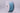Spool of blue ribbon on a gray background