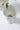 Close-up of speckled ceramic bee compote planter interior with pedestal base