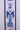 Front view of white holiday ribbon with blue nutcracker design
