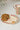 Cookies on a 'Cookies for Santa' plate with a mug in the background
