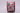Christmas-themed ribbon with snowmen, trees, and presents on a pink background