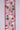 Decorative ribbon with Christmas-themed designs on a pink background