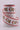 Christmas Highland cow ribbon with Santa hats and red white candy cane stripe edges on ribbon spool