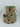 Decorative floral ribbon with wired edges unspooled to showcase sage green and rose design
