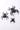 Black sheet metal spider decorations hanging on a white wall for Halloween decor