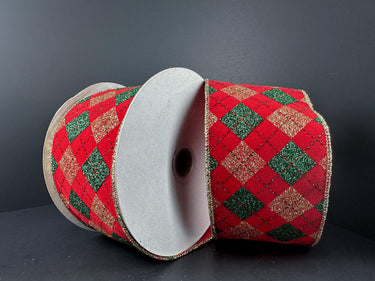Red and green checkered ribbon on a spool against a dark background