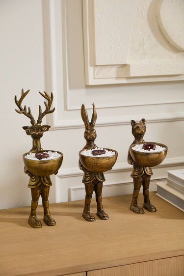 Antique gold E+E dish stands holding a round bowl