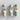 Set of three green botanical-print tubes containing safety matches