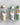 Set of three green botanical-print tubes containing safety matches