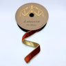 Cinnamon velvet wired ribbon with metallic gold backing on a 1-inch by 10-yard roll.