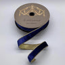 Ribbon unrolled showing contrast between navy front and gold back
