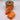 Bright orange dupion ribbon with floral embroidery and sequin accents on spool. 2.5 inches wide by 10 yards long.