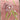 Embroidered fabric with oyster design and pearls on a pink background