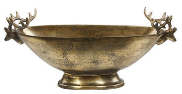 Antique gold aluminum pedestal bowl with decorative deer heads and antlers at both ends, measuring 23.5 inches long.