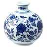Small round ceramic vase with blue floral pattern and narrow neck, 3.25 inches tall