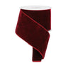 A roll of deep burgundy velvet ribbon with a twisted edge, shown on a clean white background.