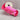 Roll of pink ribbon with floral pattern on a gray background
