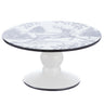 White ceramic pedestal cake plate with a black rim and woodland reindeer illustration, measuring 10 inches in diameter for holiday desserts and seasonal displays.