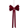 Burgundy velvet Christmas bow ornament with layered loops, two long narrow tails, and an attached hanging loop.