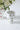Buzzy ceramic compote planter with hand-painted bumble bee details and speckled white finish