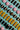 Assorted chocolates including pink, yellow, and brown on a blue background