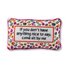 Come Sit By Me needlepoint pillow front view with ivory text panel, colorful leopard-style border, and bright pink piping