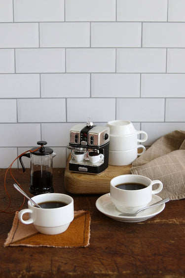 Cody Foster Espresso Machine Ornament featuring a silver and black glass espresso machine with glitter accents, tiny cups, and colorful button details.