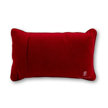 Expensive needlepoint pillow back view with red velvet backing and embroidered Furbish logo