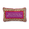 God Is Testing Me needlepoint pillow front view with leopard print, lavender center panel, and red trim