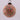Colorful beaded ball ornament on a gray background