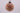 Colorful beaded ball ornament on a gray background