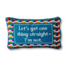 Straight needlepoint pillow front view with blue center panel, multicolor geometric border, and playful text