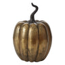 Antiqued gold metal pumpkin decor with distressed finish and sculptural black stem