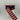 Front and back of patriotic ribbon showing navy stars and red-white stripes