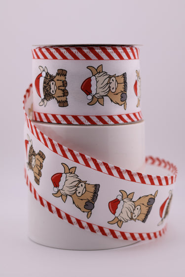 Christmas Highland cow ribbon with Santa hats and red white candy cane stripe edges on ribbon spool 