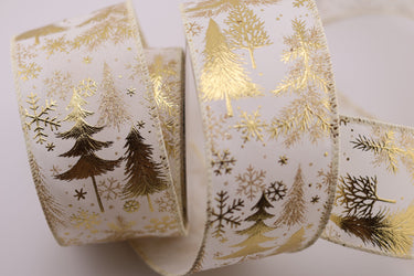 Close-up of metallic gold tree and snowflake pattern on white ribbon