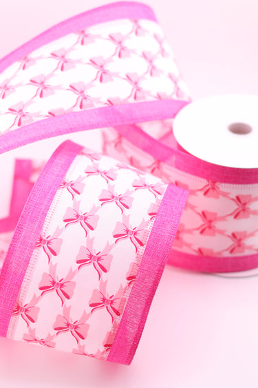 Decorative ribbon with repeating pink bows and wired edges for crafting