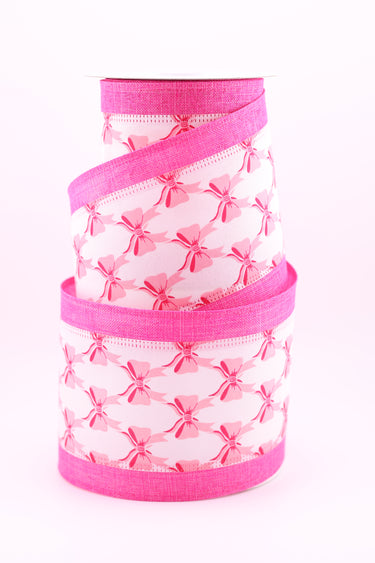 Pink bow pattern ribbon with white center and textured pink edges on spool