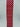 Red wired ribbon with repeating pink heart pattern on a vertical spool view