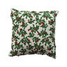 Square cotton pillow with embroidered green mistletoe and red berries on white background.